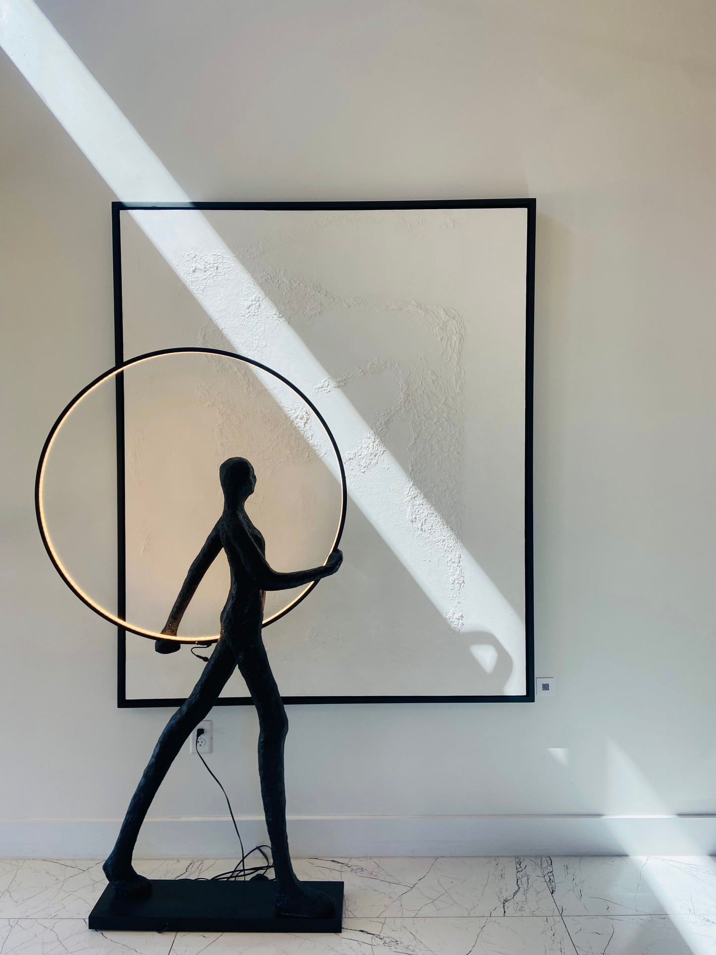 Figurative Sculpture with LED Circle